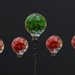 a group of light bulbs with flowers in them