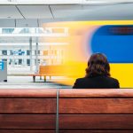 woman sitting at train station