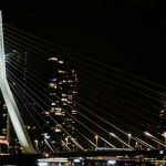 a large bridge with lights at night