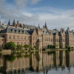 A large building sitting next to a body of water