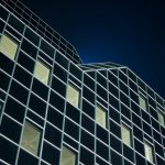 low angle photography of black building during night