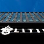 Modern building with "politie" sign under blue sky