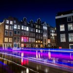 time-lapse photography of busy road and classic establishment